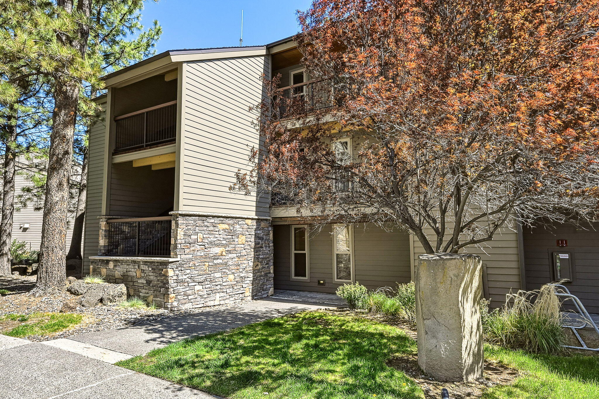 18575 Southwest Century Drive, Unit 232 Bend, OR 97702 - Photo 19 of 37 a view of a house with backyard and a tree