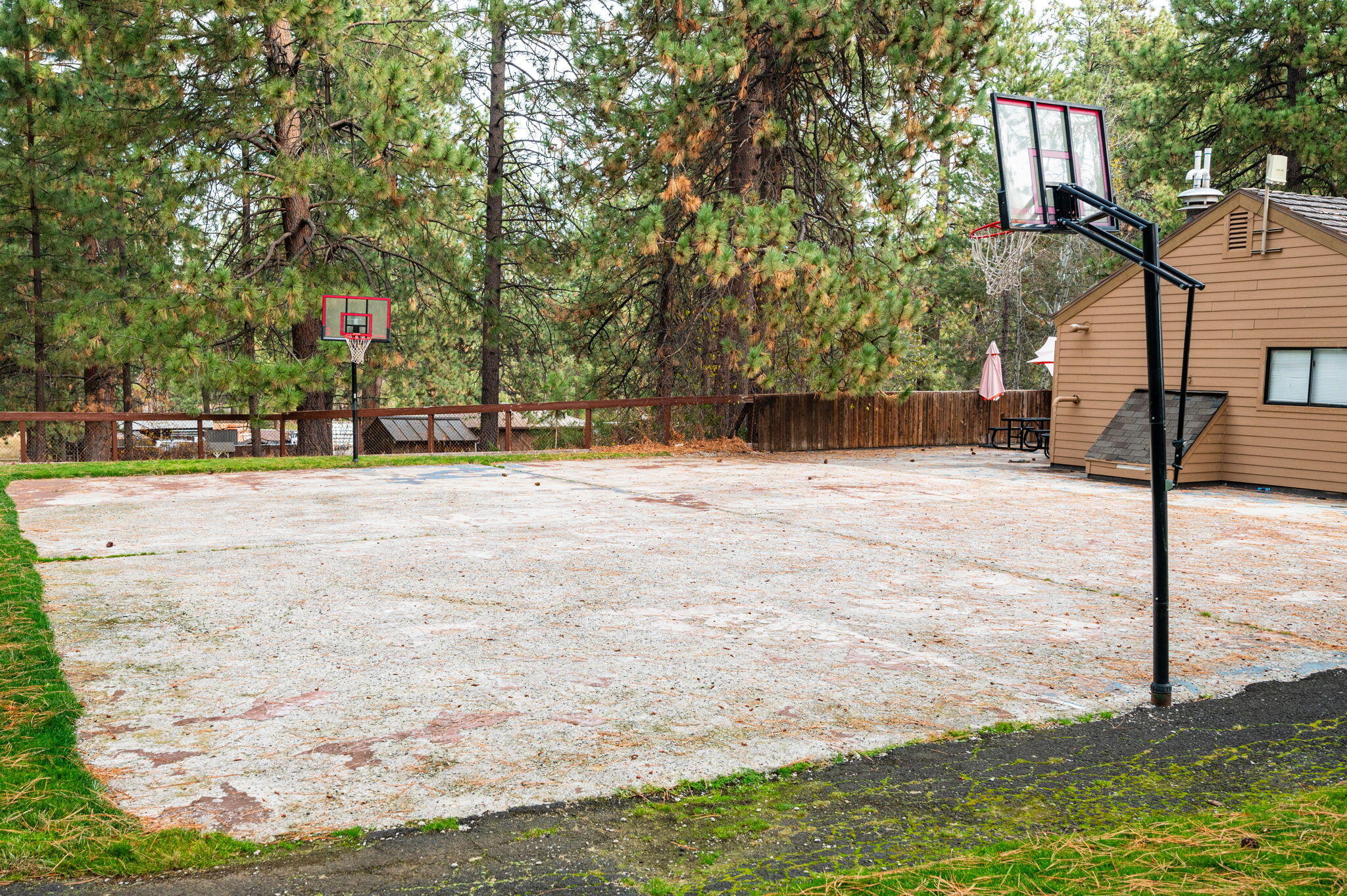 18575 Southwest Century Drive, Unit 232 Bend, OR 97702 - Photo 23 of 37 a swimming pool with trees in the background