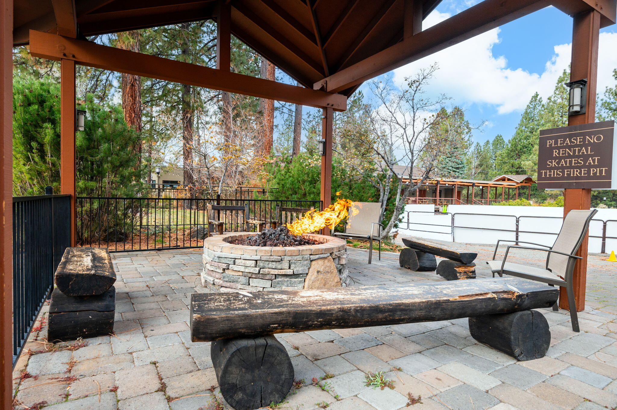18575 Southwest Century Drive, Unit 232 Bend, OR 97702 - Photo 29 of 37 a living room with patio furniture and a garden
