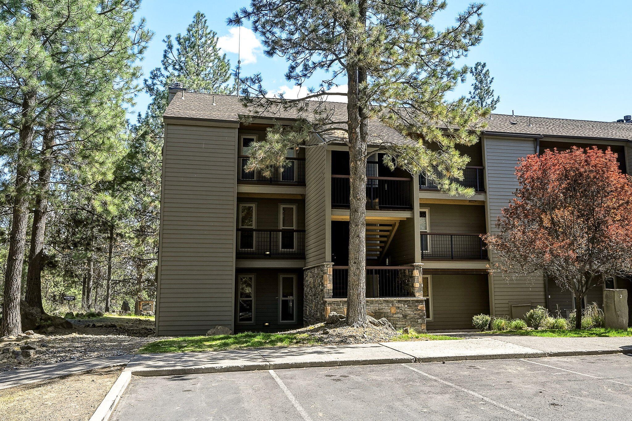 18575 Southwest Century Drive, Unit 232 Bend, OR 97702 - Photo 35 of 37 a view of a brick house with a large windows