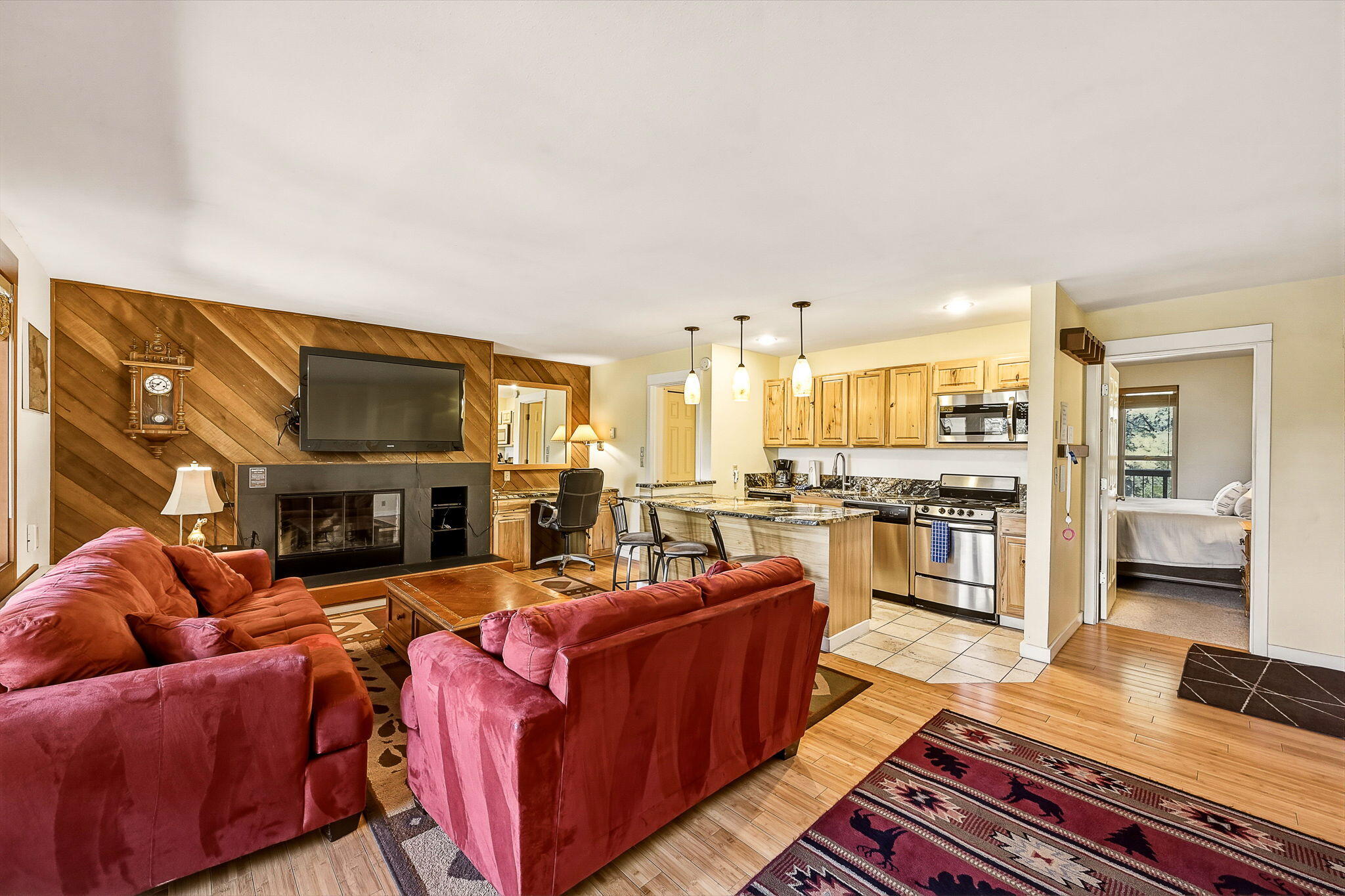 18575 Southwest Century Drive, Unit 232 Bend, OR 97702 - Photo 2 of 37 a living room with fireplace furniture and a flat screen tv