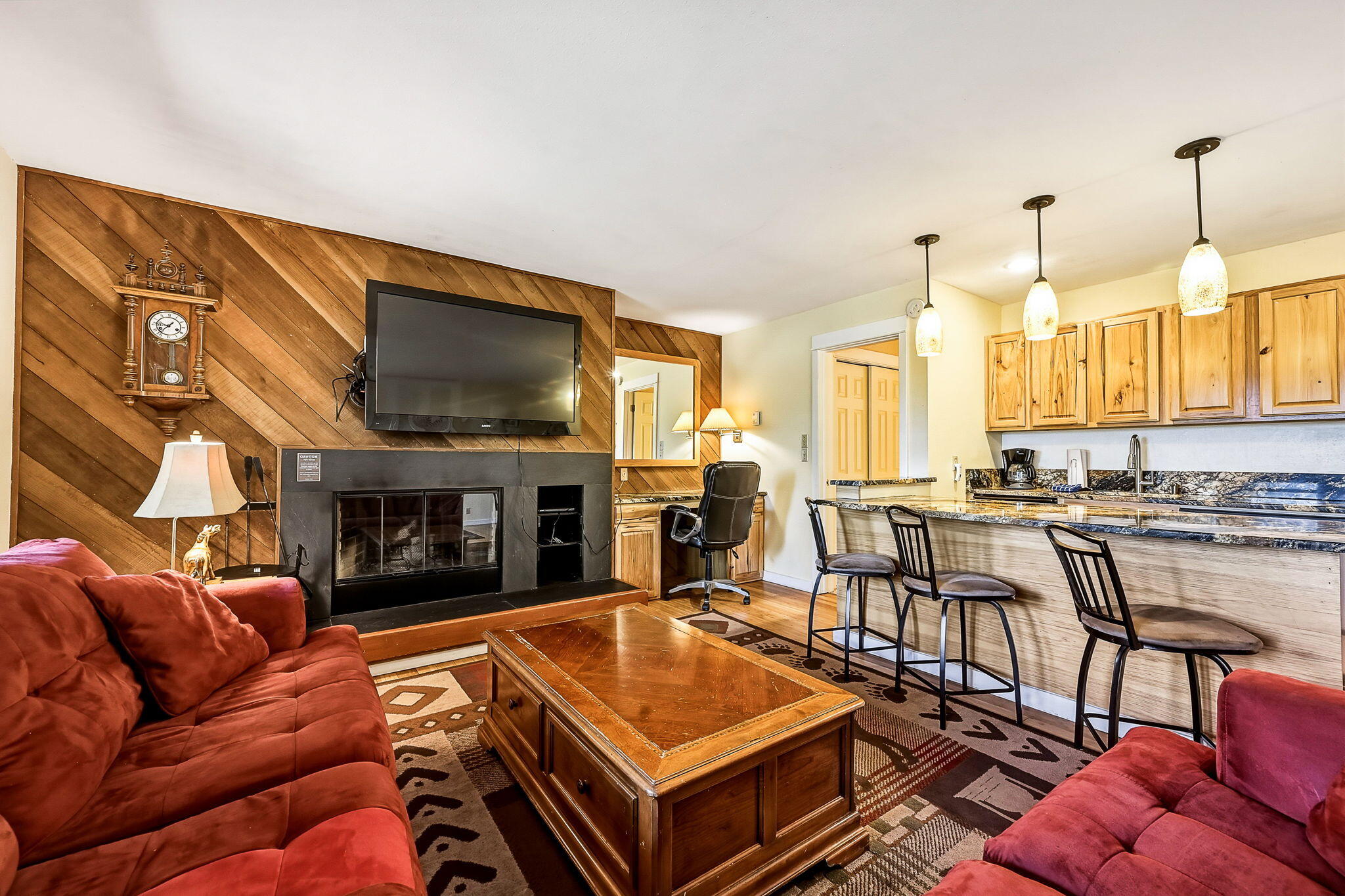 18575 Southwest Century Drive, Unit 232 Bend, OR 97702 - Photo 3 of 37 a living room with furniture a flat screen tv and a fireplace