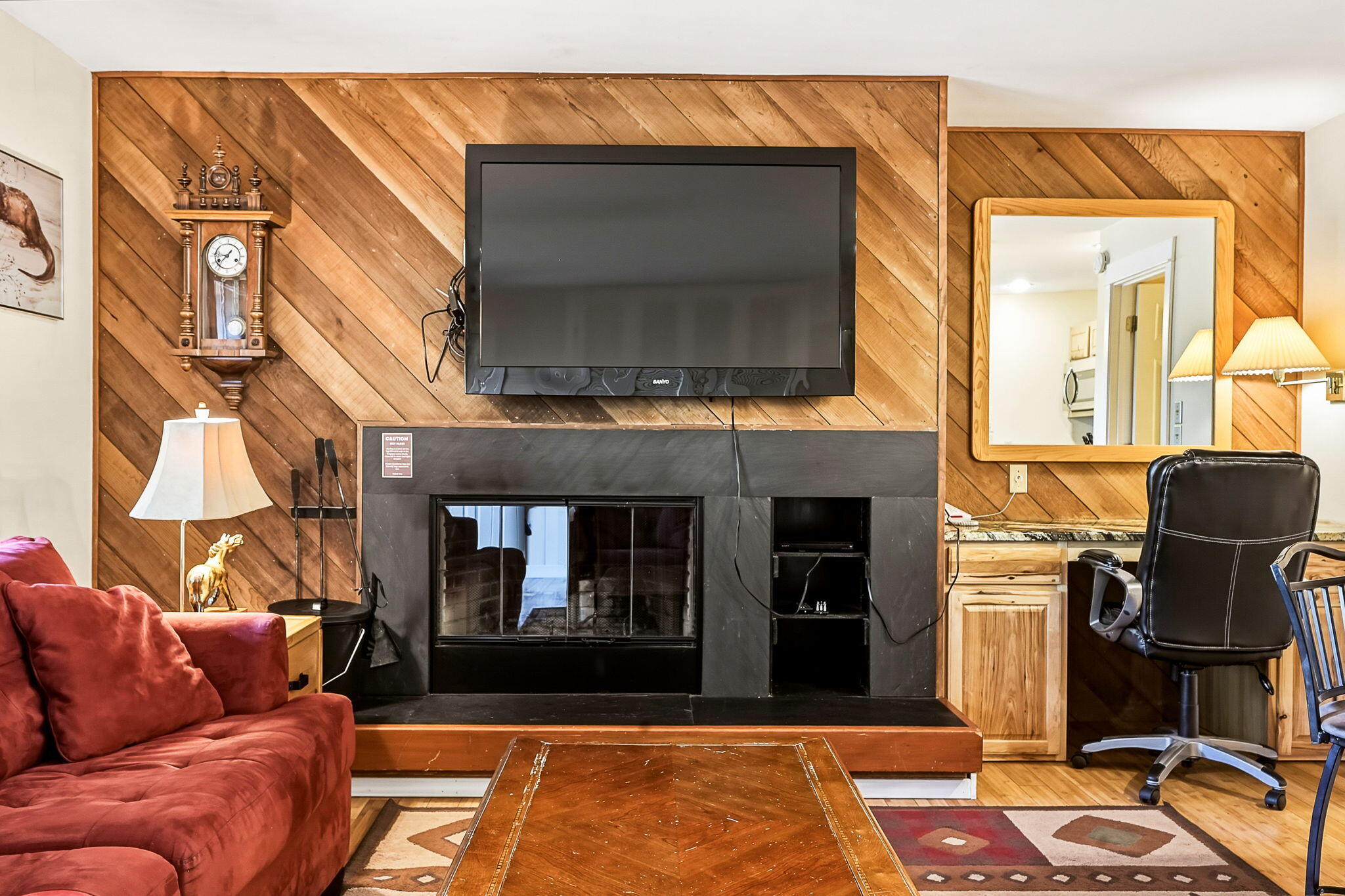 18575 Southwest Century Drive, Unit 232 Bend, OR 97702 - Photo 4 of 37 a living room with furniture and a fireplace