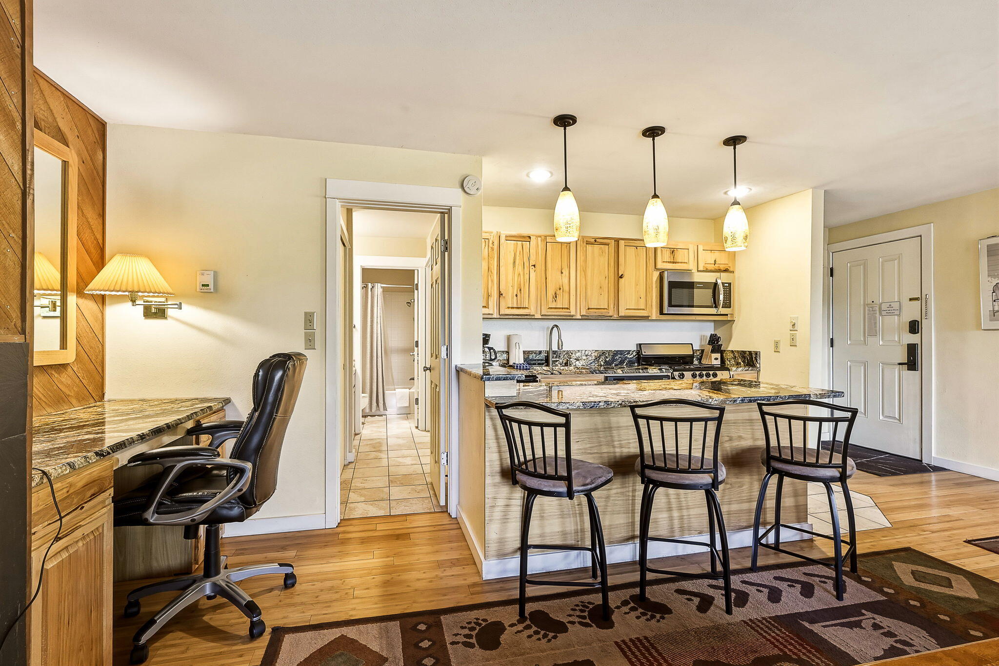 18575 Southwest Century Drive, Unit 232 Bend, OR 97702 - Photo 7 of 37 a view of a dining room with furniture and a chandelier
