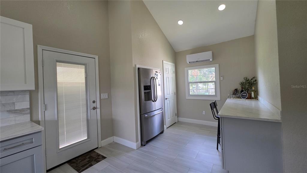 13330 Fort King Road Dade City, FL 33525 - Photo 17 of 43 a kitchen with a refrigerator and countertop