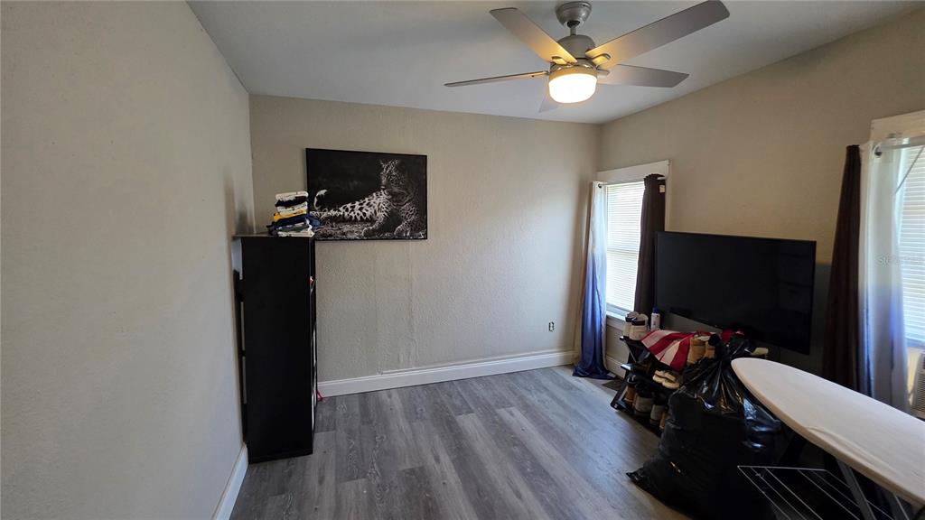 13330 Fort King Road Dade City, FL 33525 - Photo 20 of 43 a view of a workspace with furniture and a flat screen tv