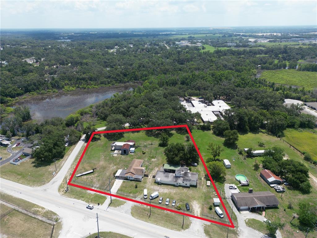13330 Fort King Road Dade City, FL 33525 - Photo 2 of 43 an aerial view of swimming pool and mountain view in back