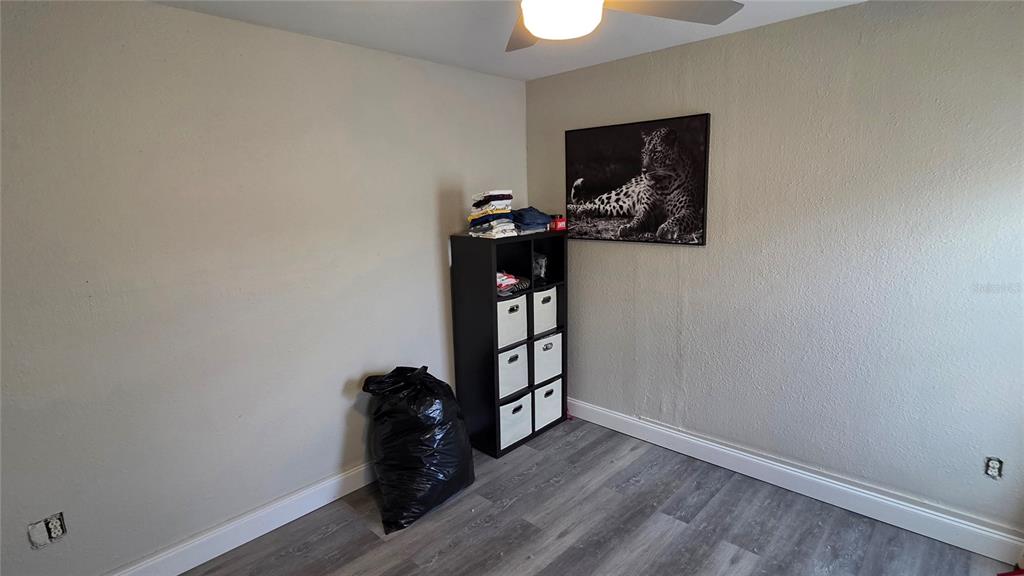 13330 Fort King Road Dade City, FL 33525 - Photo 21 of 43 a view of a workspace with wooden floor and a window