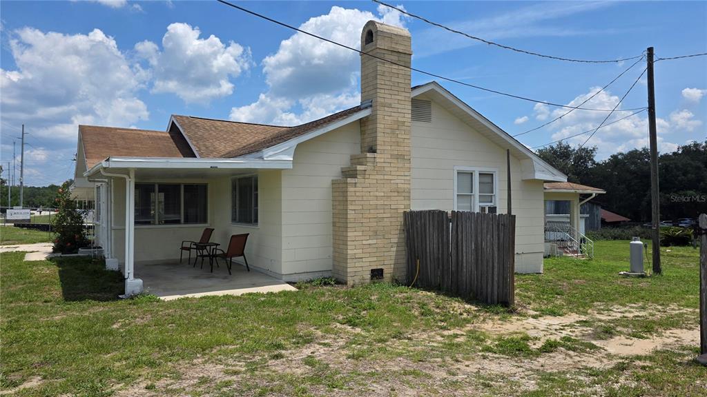 13330 Fort King Road Dade City, FL 33525 - Photo 26 of 43 a backyard of a house with yard and outdoor seating