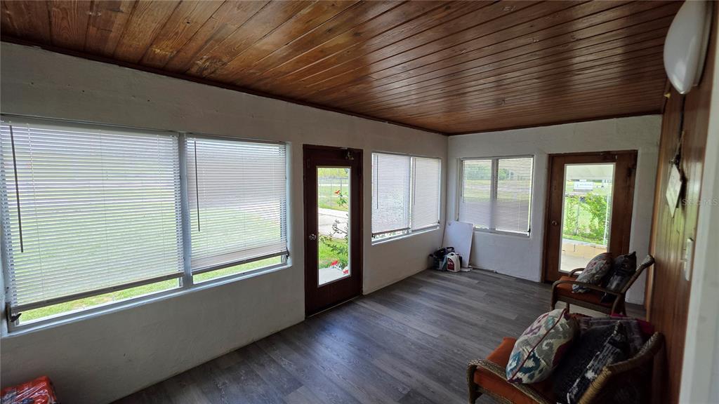 13330 Fort King Road Dade City, FL 33525 - Photo 3 of 43 a room with wooden floor and furniture