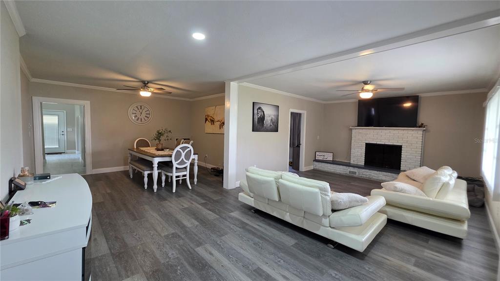 13330 Fort King Road Dade City, FL 33525 - Photo 5 of 43 a living room with furniture and a fireplace