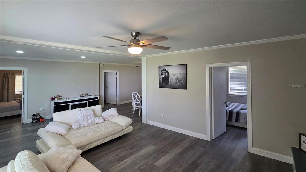 13330 Fort King Road Dade City, FL 33525 - Photo 7 of 43 a living room with furniture and a ceiling fan