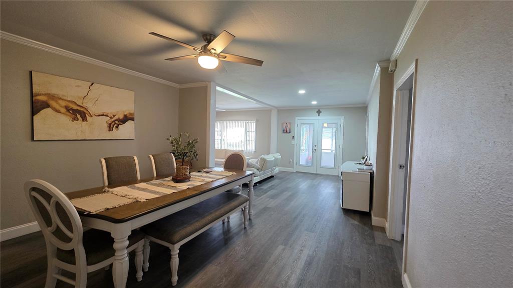 13330 Fort King Road Dade City, FL 33525 - Photo 8 of 43 a view of a dining room with furniture and wooden floor