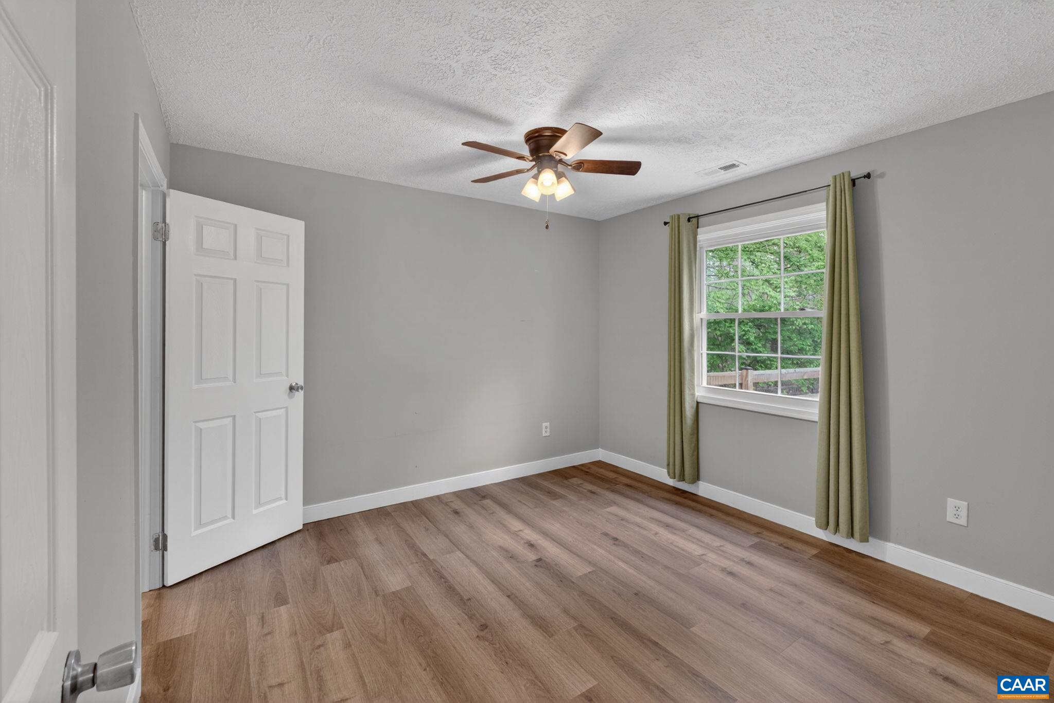 673 Cedar Lane Road Palmyra, VA 22963 - Photo 23 of 47 a view of an empty room with a window