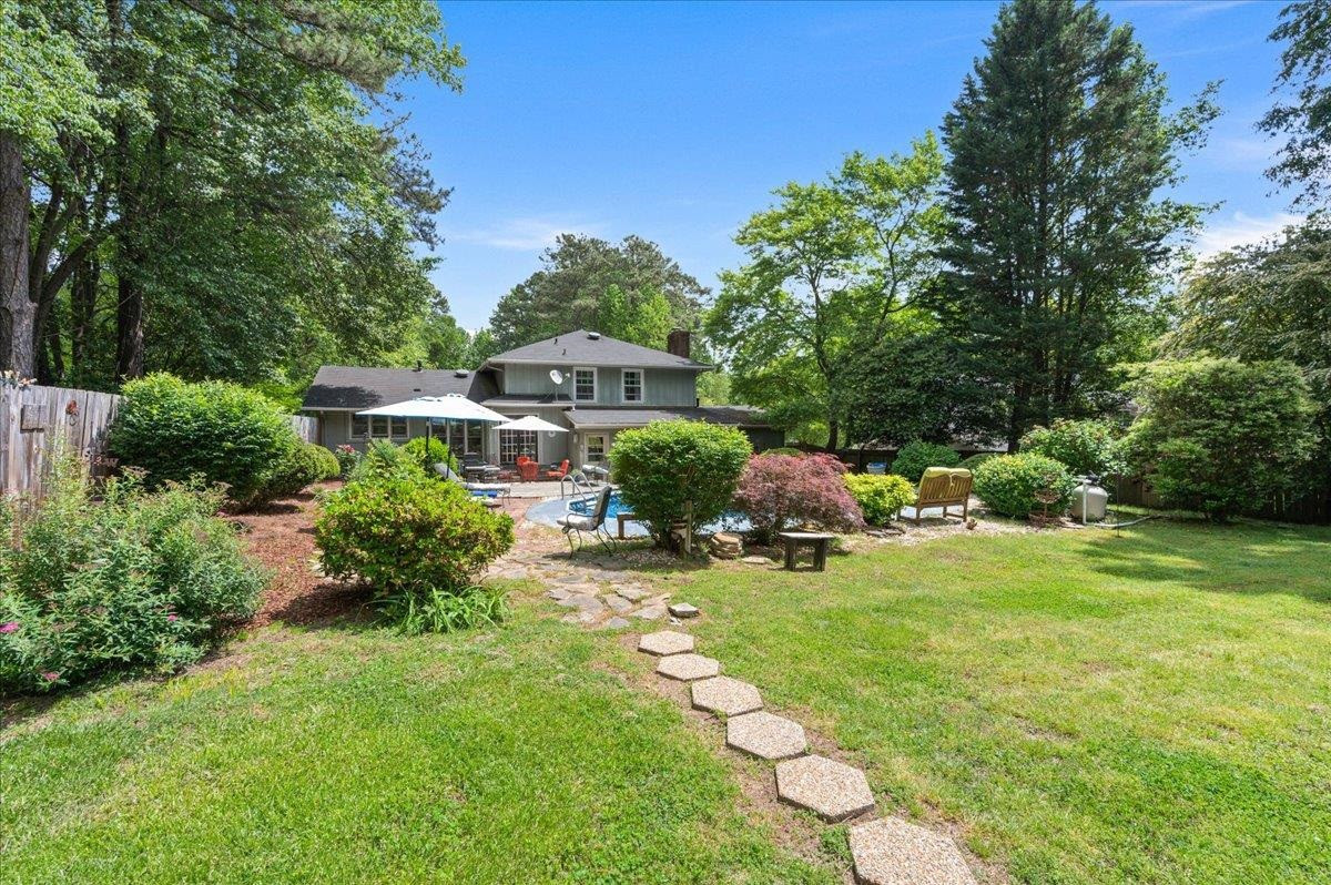 7709 Fiesta Way Raleigh, NC 27615 - Photo 22 of 25 Fenced in pool with flat back yard