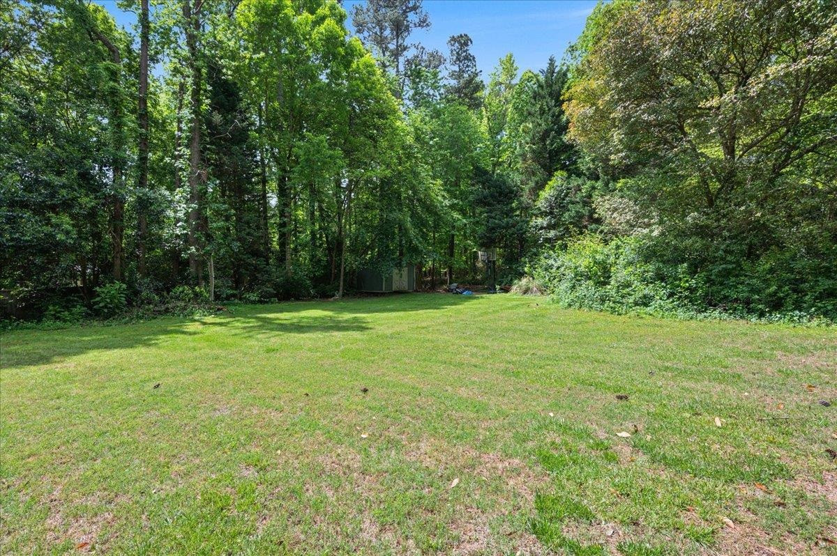 7709 Fiesta Way Raleigh, NC 27615 - Photo 23 of 25 Large backyard