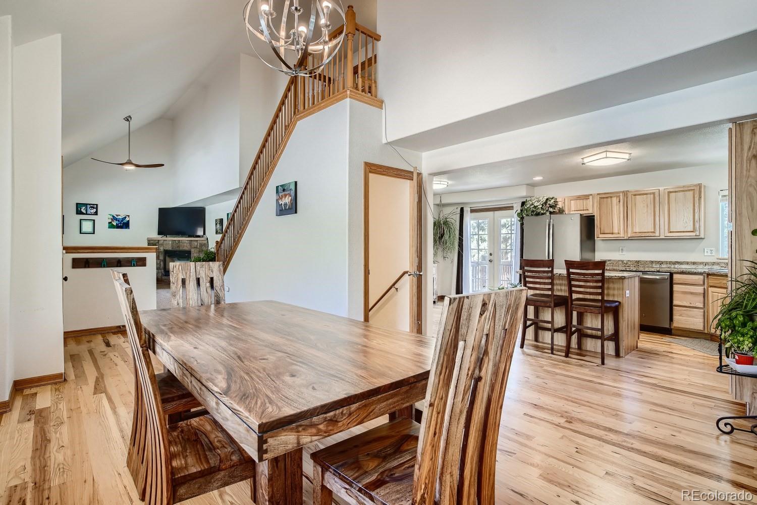 731 Hitchrack Road Bailey, CO 80421 - Photo 3 of 22 a dining room with furniture and wooden floor