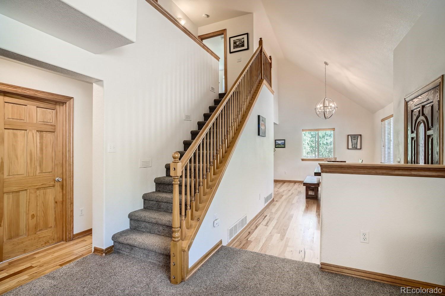 731 Hitchrack Road Bailey, CO 80421 - Photo 10 of 22 a view of entryway and hall with wooden floor