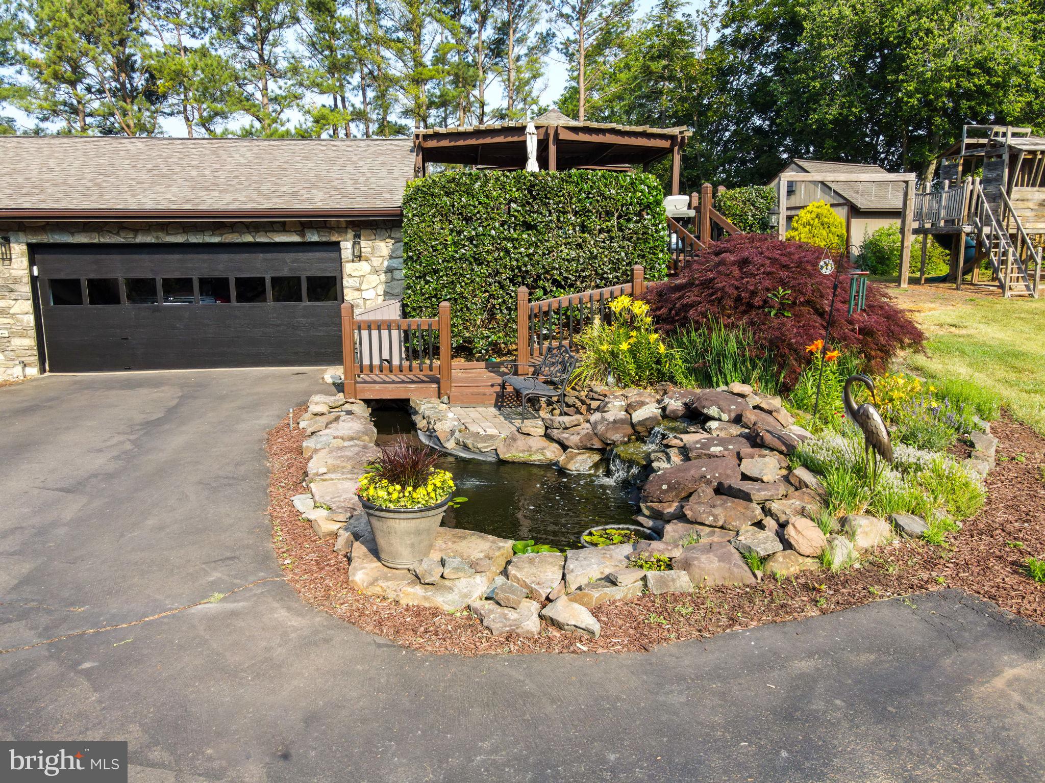 4208 High Ridge Road Haymarket, VA 20169 - Photo 48 of 62 Sit and listen to the waterfall by the Koi Pond!