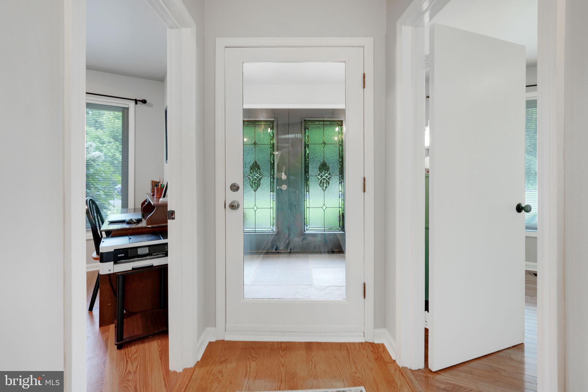 Foyer with Stone Flooring Opens to Main House.