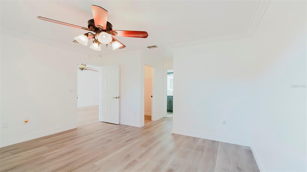 4225 La Pasida Lane New Port Richey, FL 34655 - Photo 25 of 55 a view of a room with wooden floor and white walls