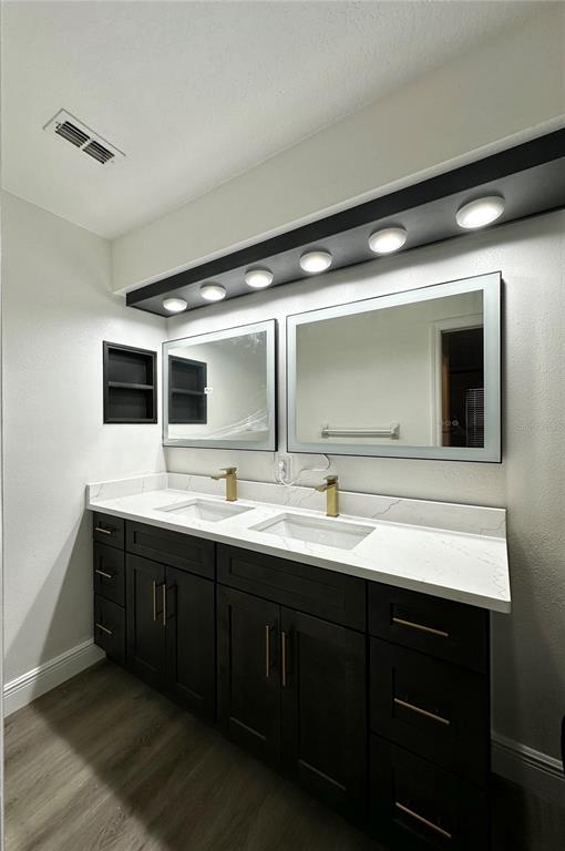 4225 La Pasida Lane New Port Richey, FL 34655 - Photo 31 of 55 a bathroom with a double vanity sink and mirror