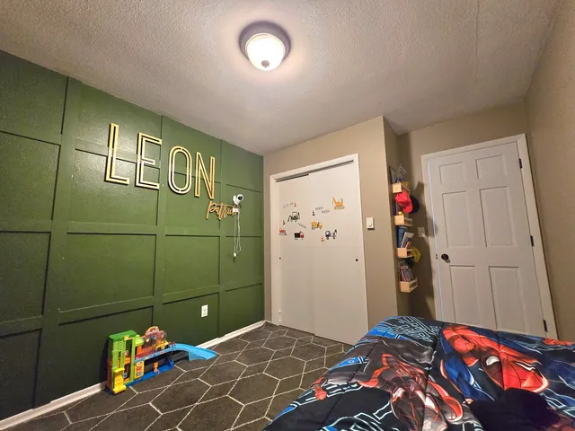 a bedroom with a bed and a closet