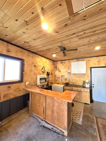 a very nice looking kitchen with a large window