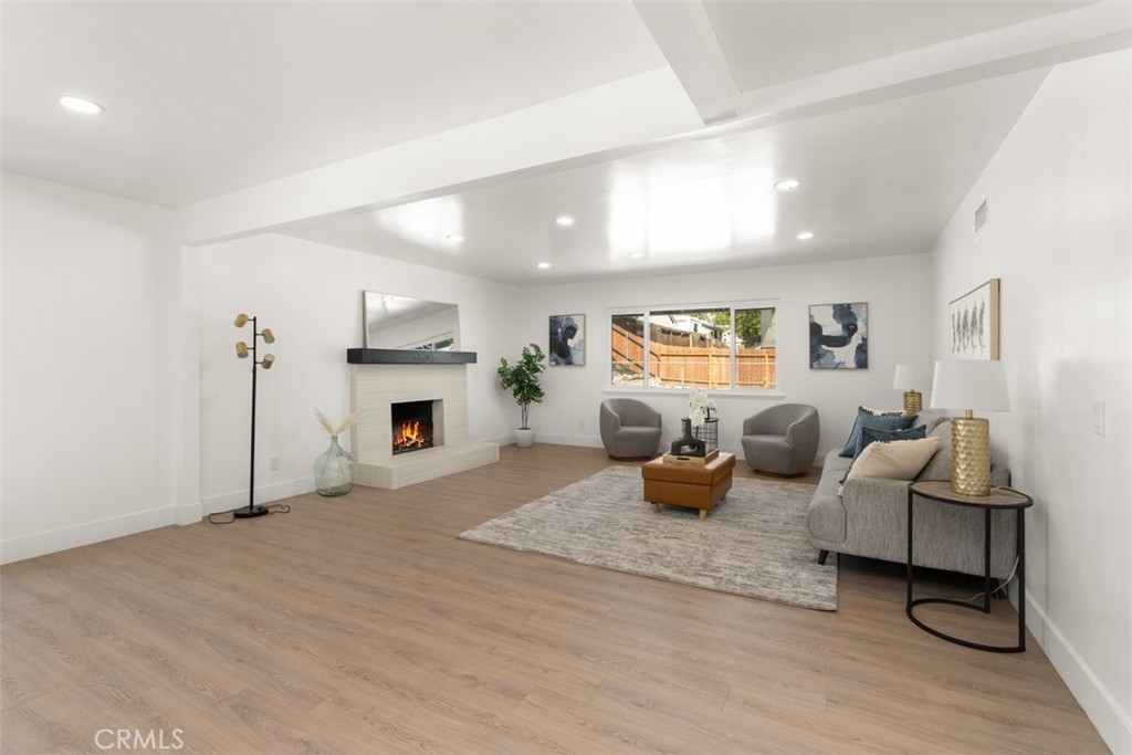 5417 Peacock Lane Riverside, CA 92505 - Photo 15 of 44 a living room with furniture and a fireplace