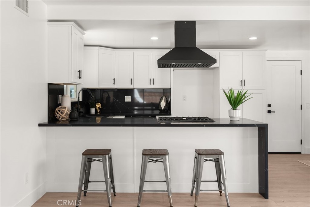 5417 Peacock Lane Riverside, CA 92505 - Photo 20 of 44 a kitchen with stainless steel appliances a counter top space and cabinets