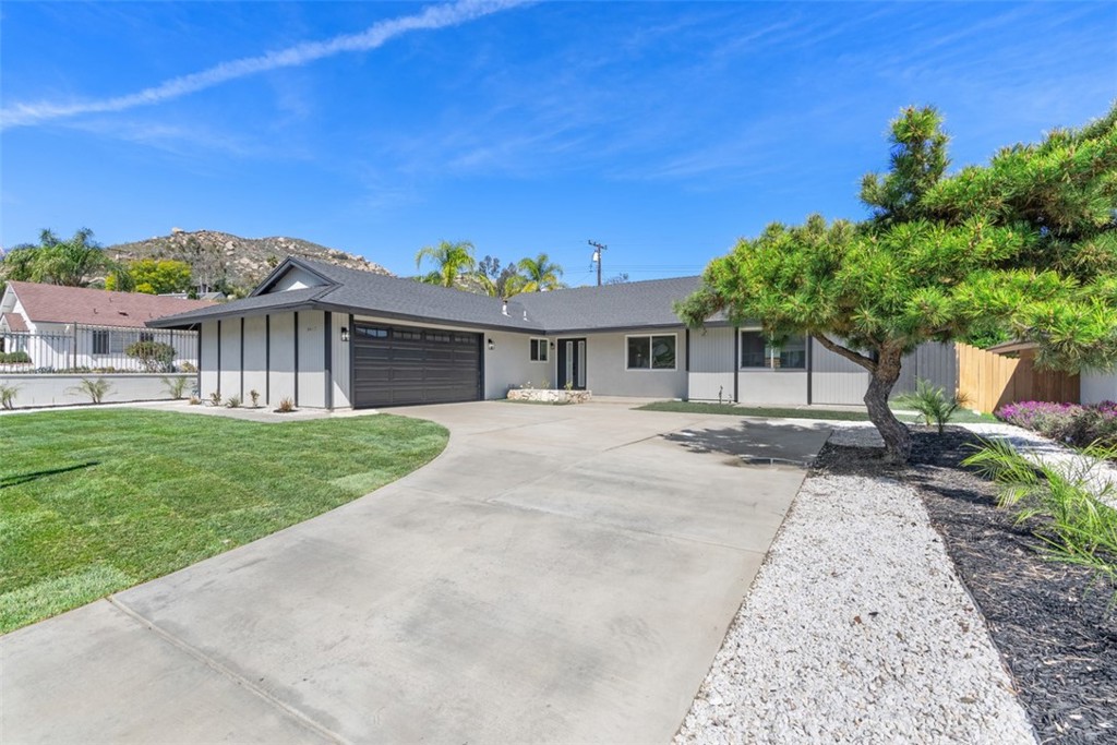 5417 Peacock Lane Riverside, CA 92505 - Photo 2 of 44 front view of a house with a yard
