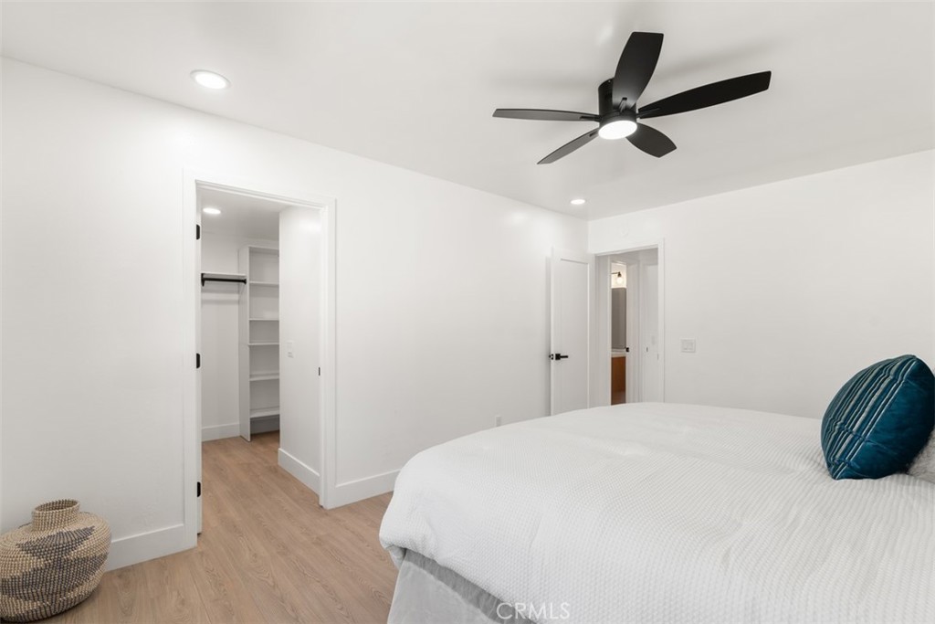 5417 Peacock Lane Riverside, CA 92505 - Photo 27 of 44 a bedroom with a bed and a ceiling fan