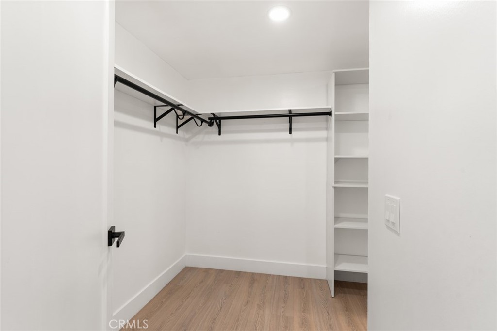 5417 Peacock Lane Riverside, CA 92505 - Photo 28 of 44 a view of walk in closet with empty racks
