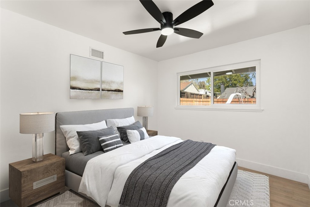 5417 Peacock Lane Riverside, CA 92505 - Photo 33 of 44 a bedroom with a large bed and a window