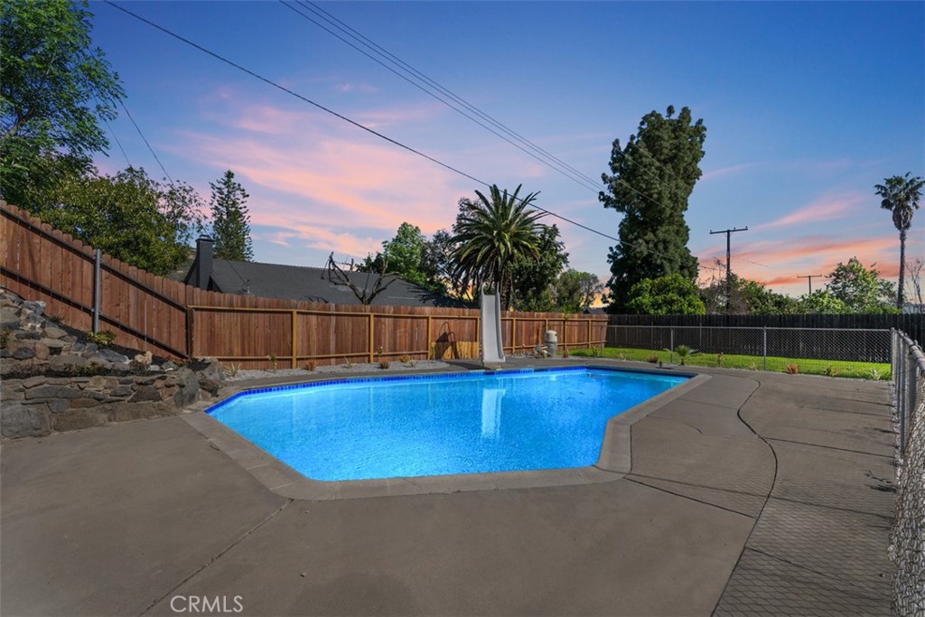 5417 Peacock Lane Riverside, CA 92505 - Photo 5 of 44 a view of a backyard with swimming pool