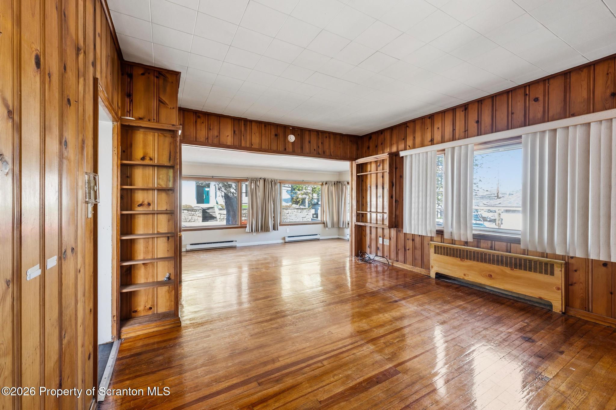 801 Adams Avenue Scranton, PA 18510 - Photo 11 of 34 a view of livingroom with furniture staircase and windows