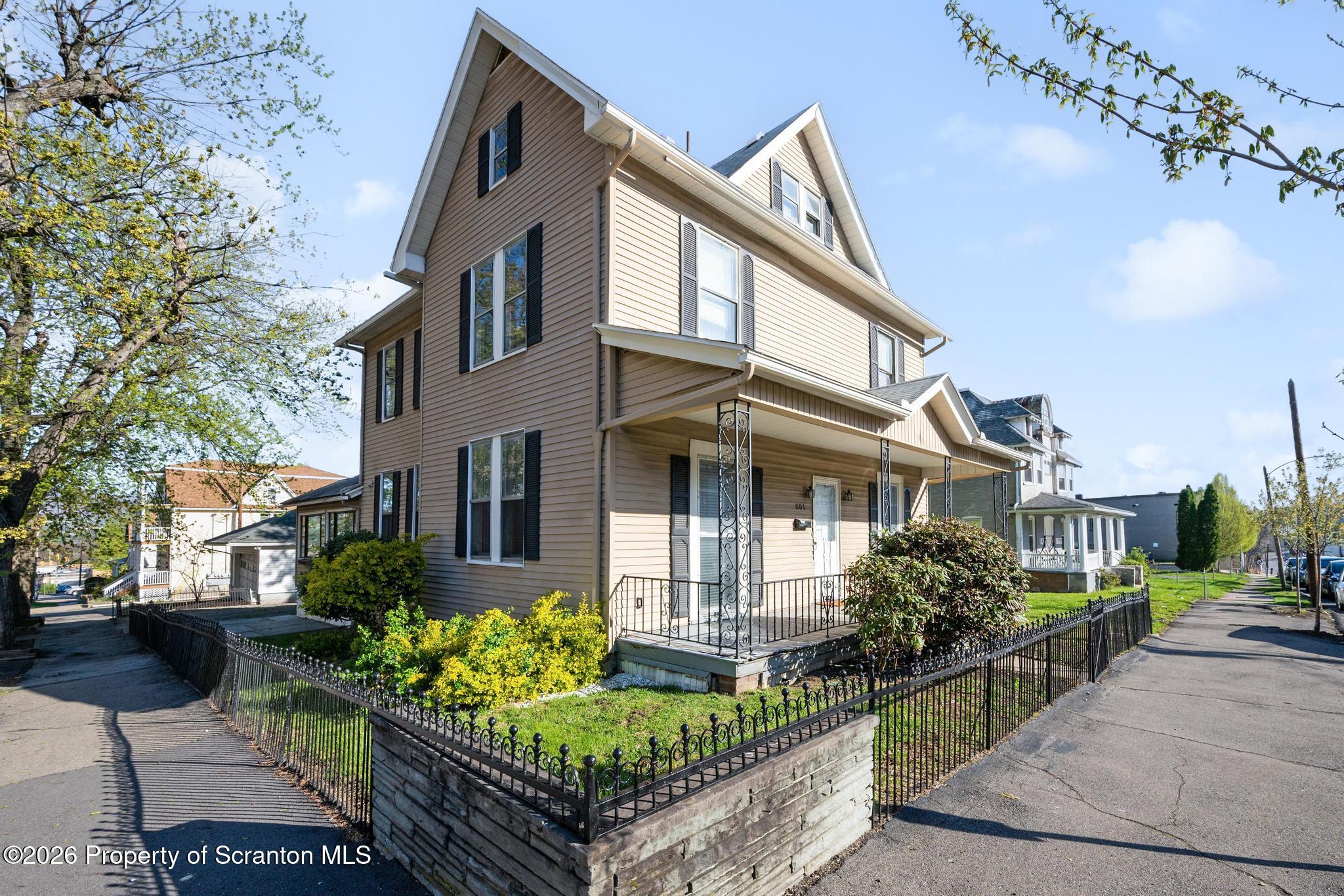 801 Adams Avenue Scranton, PA 18510 - Photo 2 of 34 a front view of a house with garden