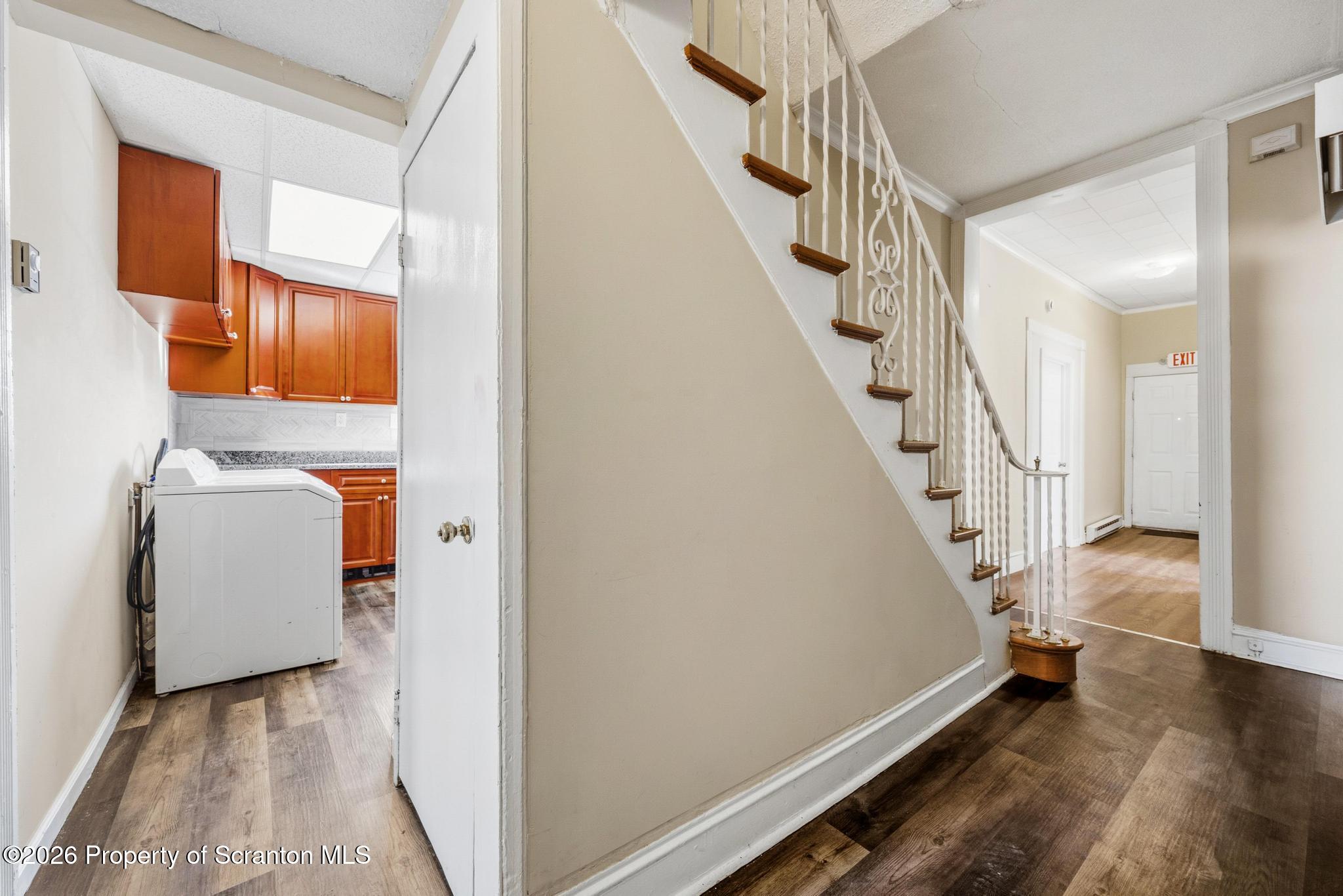 801 Adams Avenue Scranton, PA 18510 - Photo 22 of 34 a view of hallway with stairs and wooden floor