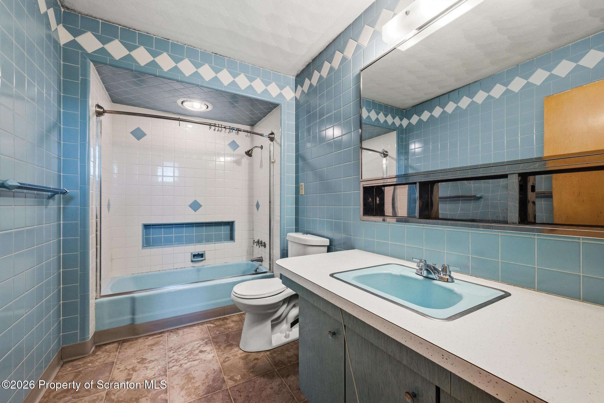 801 Adams Avenue Scranton, PA 18510 - Photo 27 of 34 a bathroom with a sink a toilet and shower