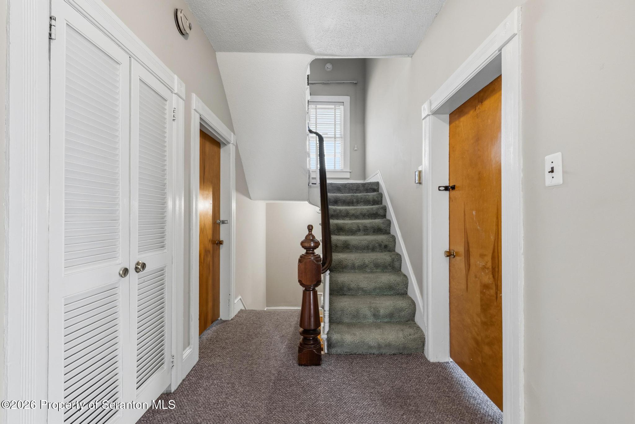 801 Adams Avenue Scranton, PA 18510 - Photo 29 of 34 a view of a hallway with wooden floor and entryway