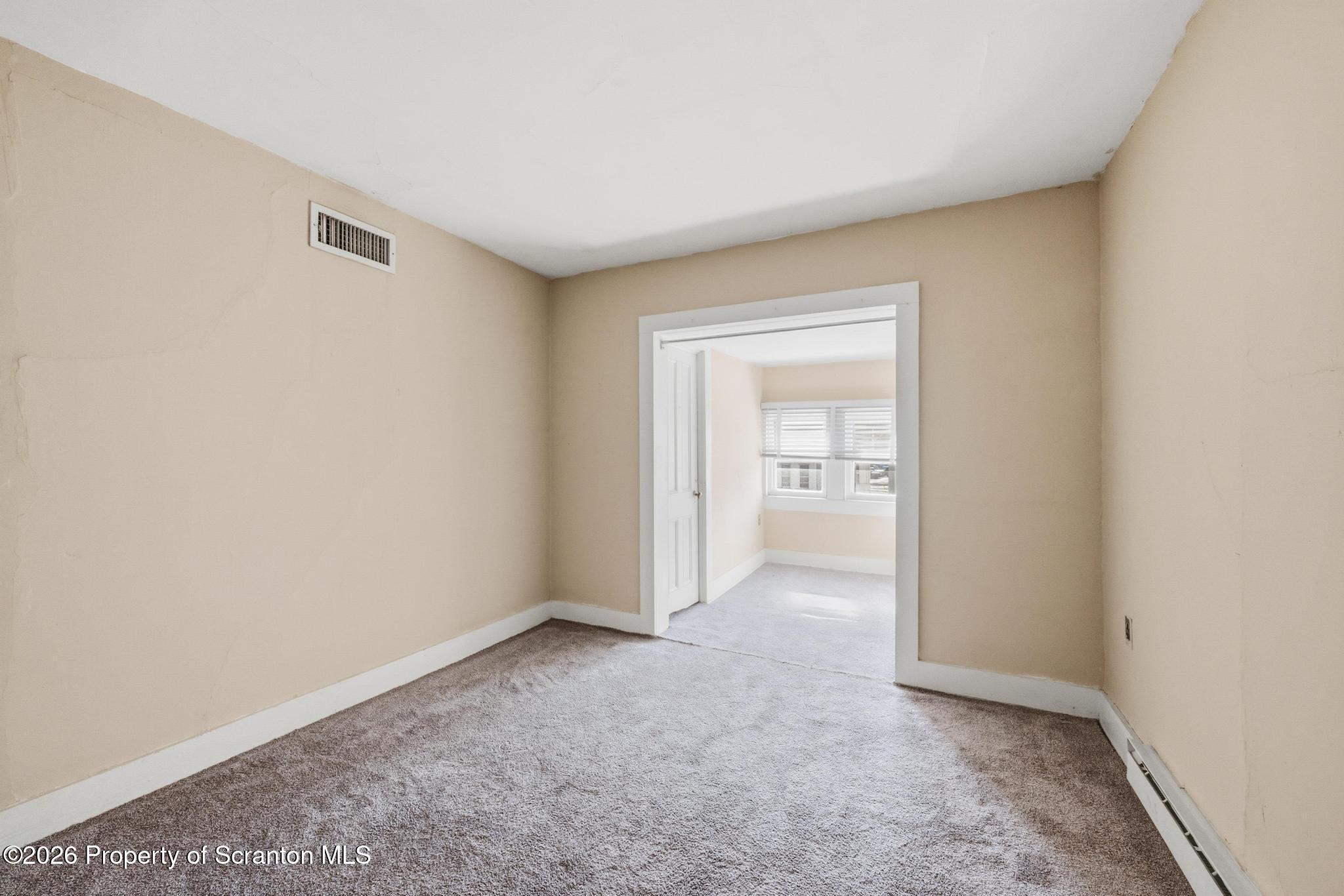 801 Adams Avenue Scranton, PA 18510 - Photo 30 of 34 a view of an empty room and a window