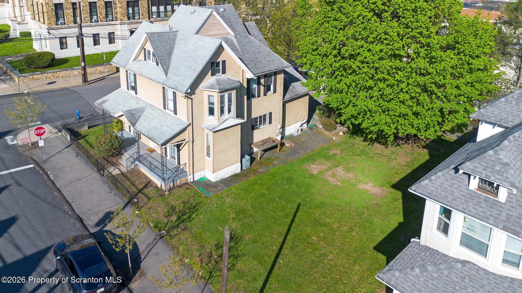 801 Adams Avenue Scranton, PA 18510 - Photo 3 of 34 an aerial view of a house with a yard