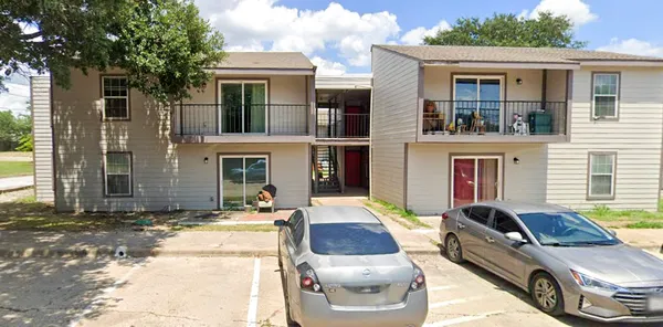 a front view of a house with outdoor seating