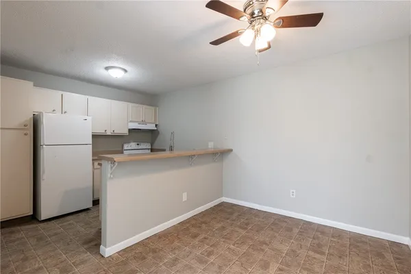 a kitchen with a refrigerator a sink and dishwasher
