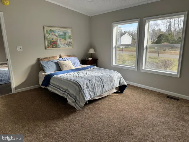 a bathroom with a shower sink vanity and toilet