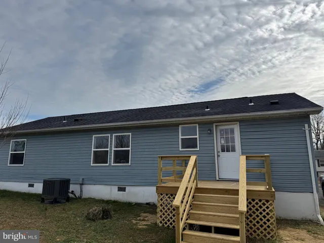 a view of a balcony with wooden floor