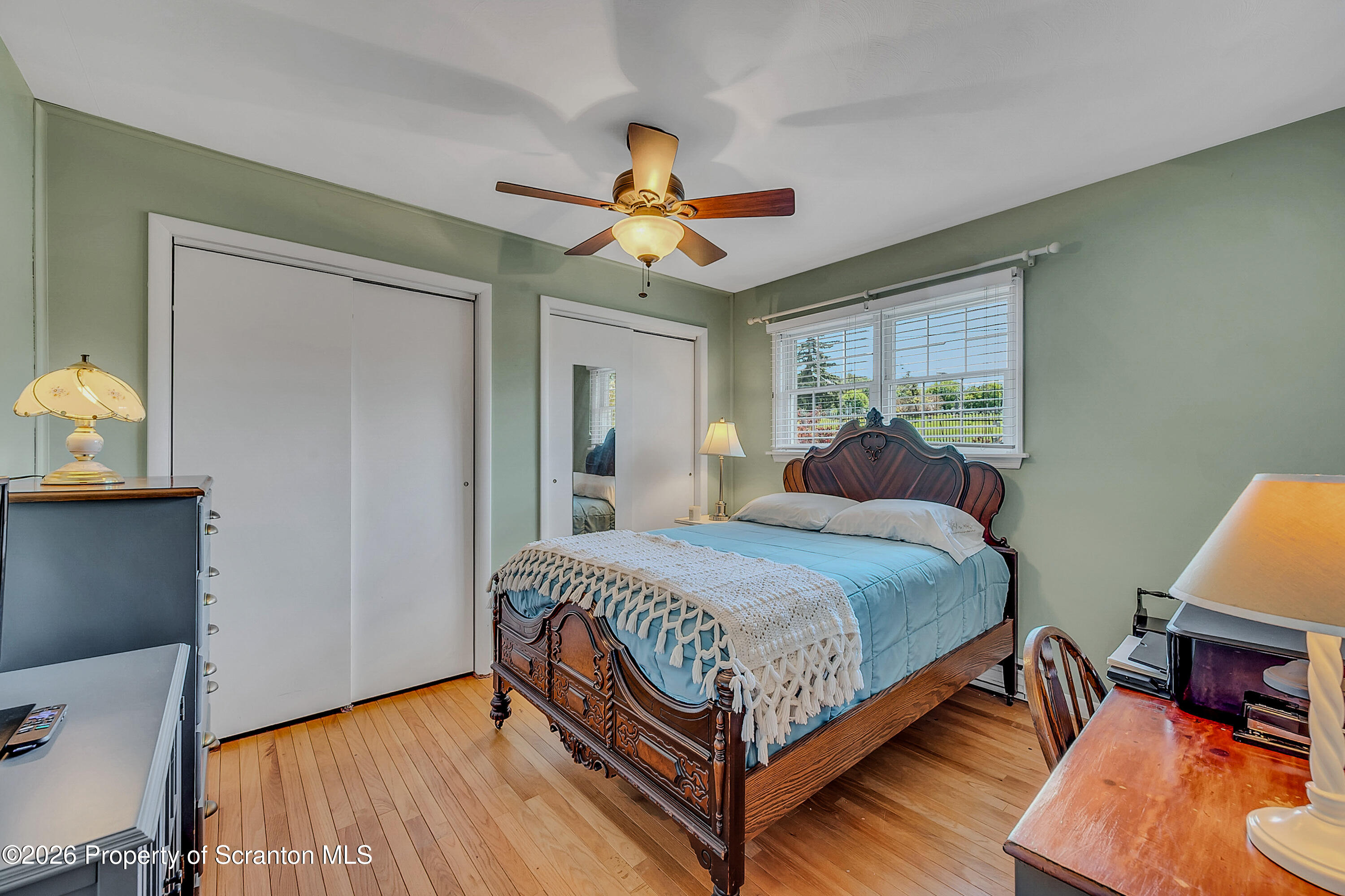 1832 West Gibson Street Scranton, PA 18504 - Photo 16 of 54 a bedroom with a bed and a chandelier