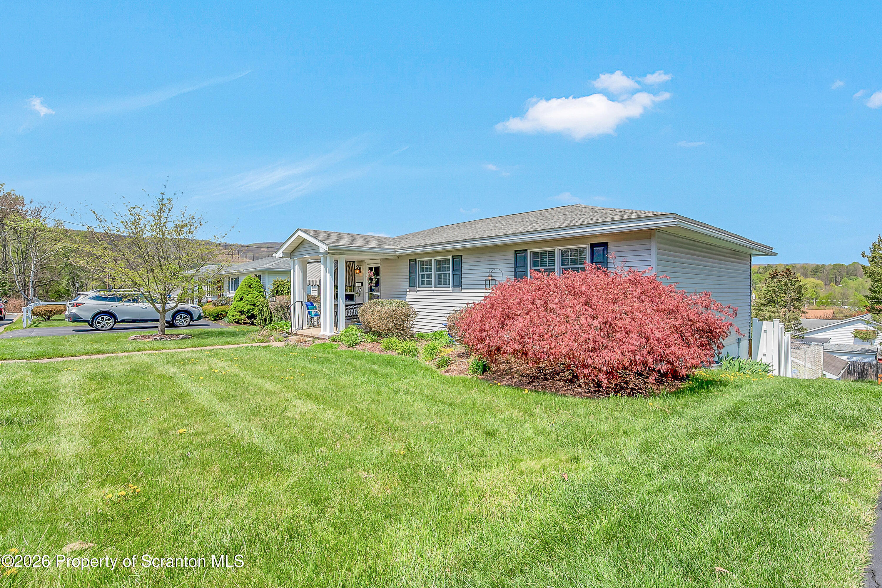 1832 West Gibson Street Scranton, PA 18504 - Photo 2 of 54 a front view of a house with a garden and yard