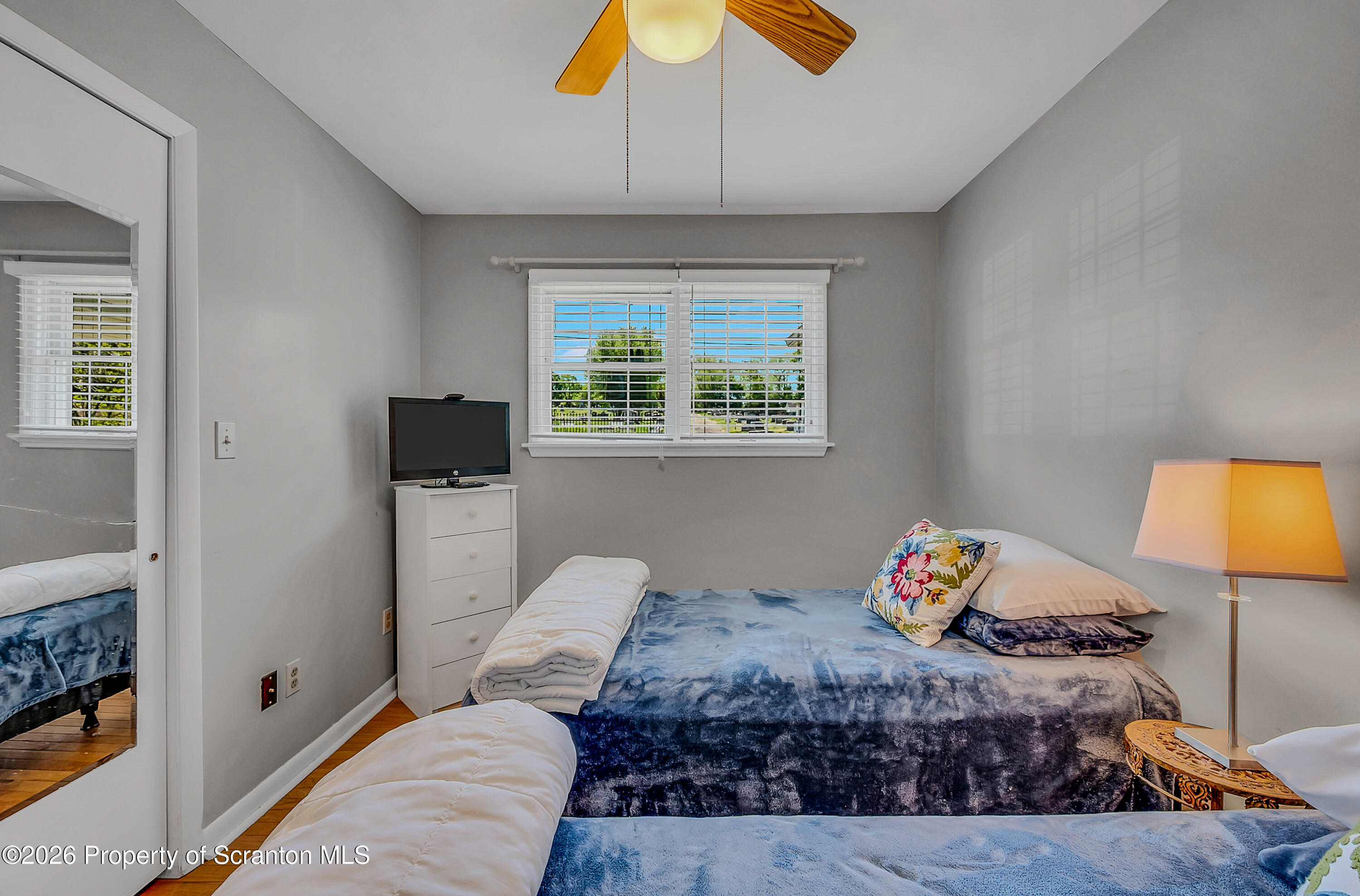 1832 West Gibson Street Scranton, PA 18504 - Photo 21 of 54 a bedroom with a bed and a chandelier