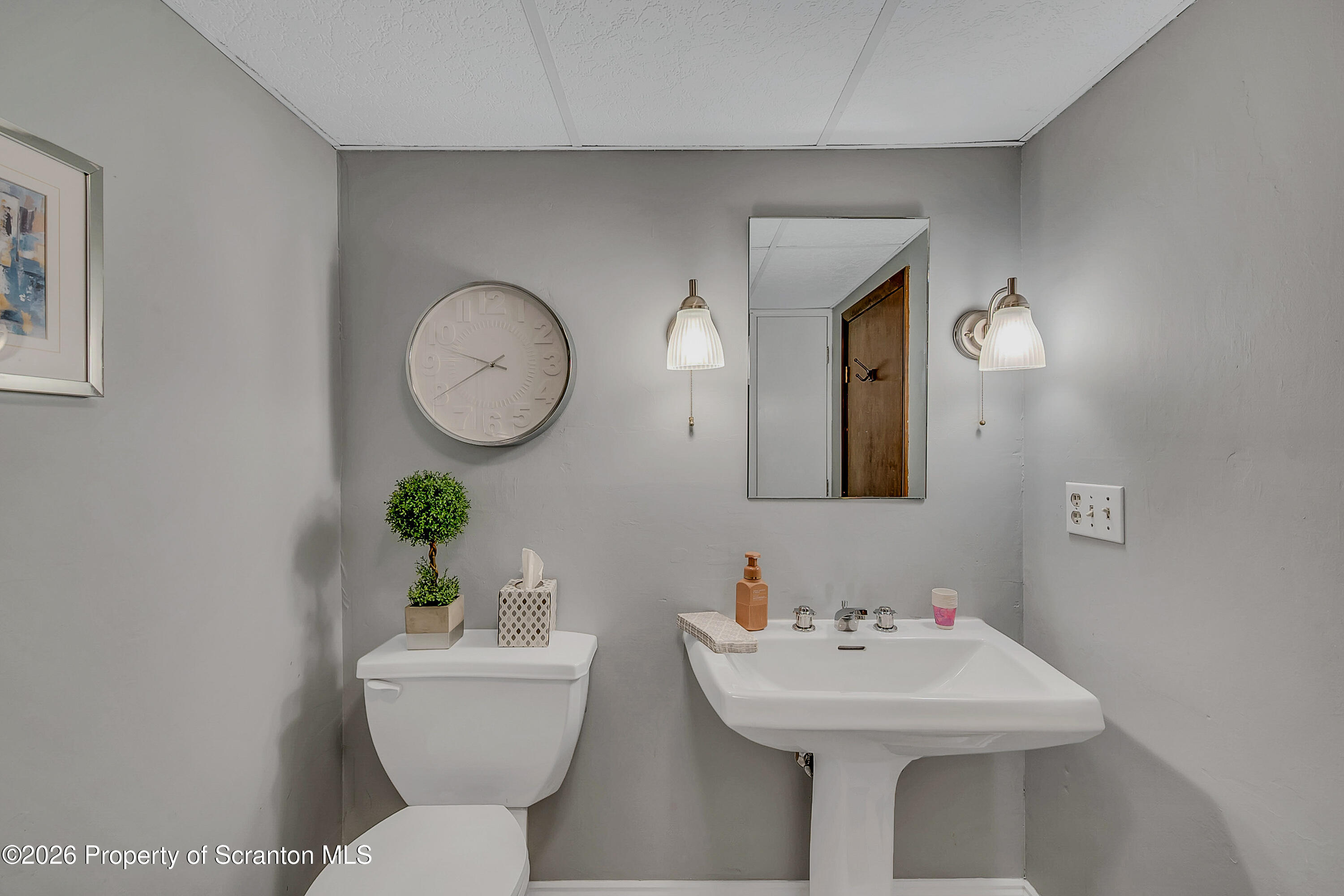 1832 West Gibson Street Scranton, PA 18504 - Photo 32 of 54 a bathroom with a toilet a sink and a mirror